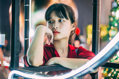 Portrait of young woman looking away