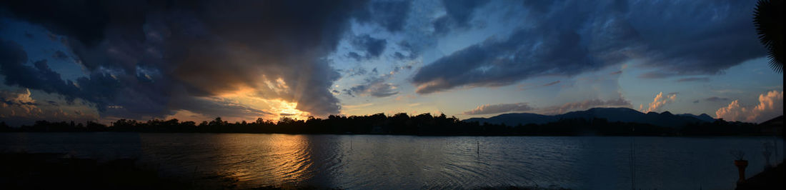 Panoramic view of lake against sky during sunset