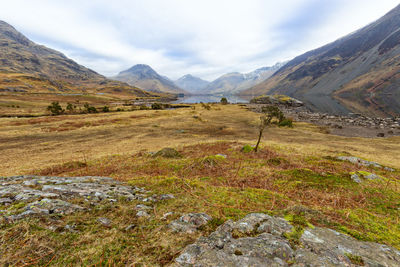 Scenic view of mountains against cloudy sky