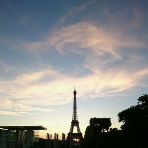 Low angle view of communications tower against sky