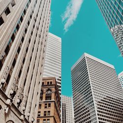 Low angle view of modern buildings against sky in city