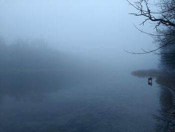 View of lake in foggy weather