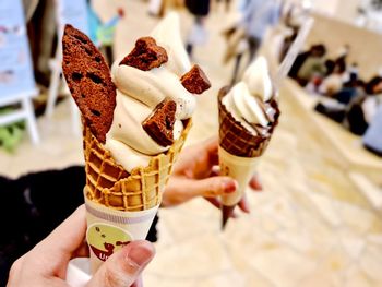 Cropped image of hand holding ice cream