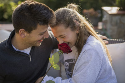 Couple kissing on bridge