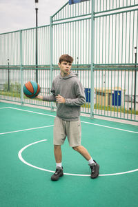 Rear view of man exercising in gym