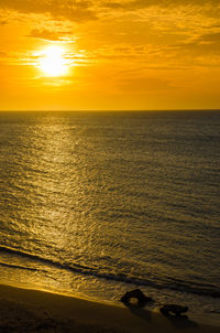 Scenic view of caribbean sea against sky during sunset