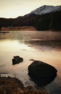 Scenic view of lake during sunset