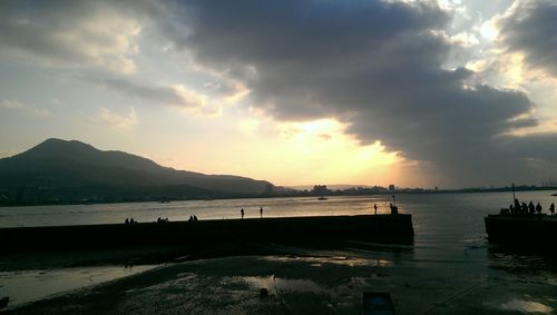 Scenic view of sea against cloudy sky