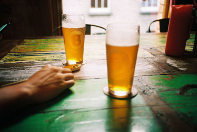 Close-up of beer glass on table