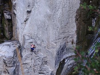 Man surfing on rock