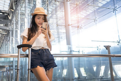 Young woman using mobile phone