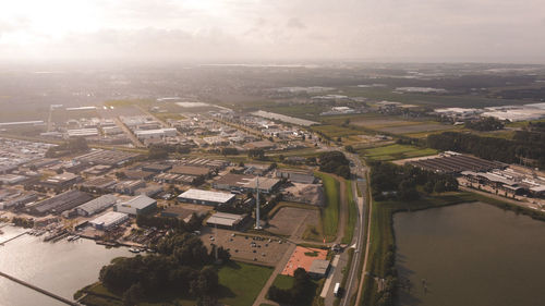 High angle view of river amidst buildings in city