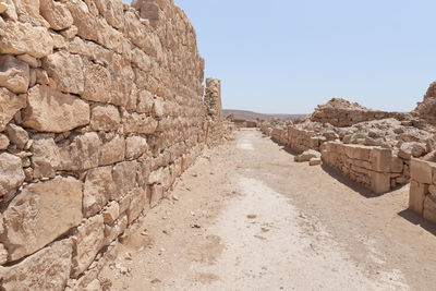 View of stone wall against clear sky