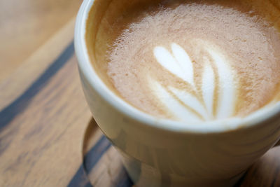 High angle view of cappuccino on table