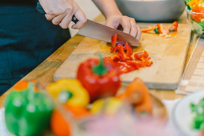 Midsection of man preparing food