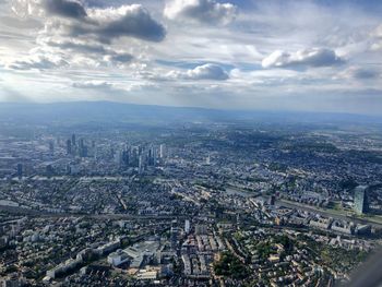 High angle view of city against cloudy sky