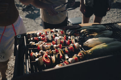 Close up of corn and skewers on a barbecue grill