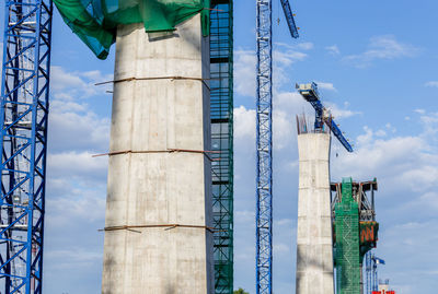 Low angle view of industrial building against sky