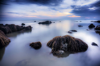 Scenic view of sea against sky during sunset