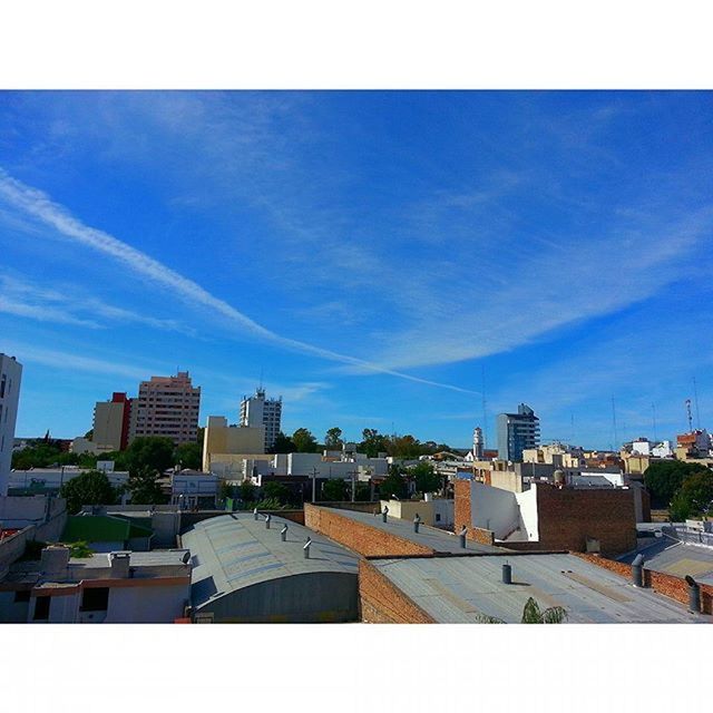 building exterior, architecture, built structure, transfer print, city, blue, sky, auto post production filter, cityscape, day, residential district, cloud, residential building, skyscraper, residential structure, sunlight, outdoors, building, cloud - sky, tower