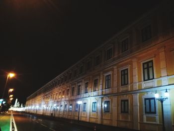 Low angle view of illuminated building at night