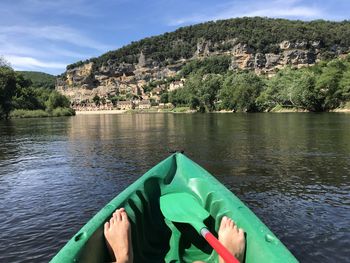 Low section of man on boat in river