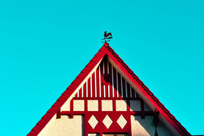 Low angle view of building against clear blue sky