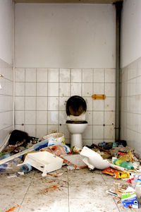 Messy abandoned bathroom in building