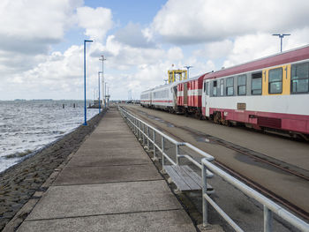 Road by sea against sky