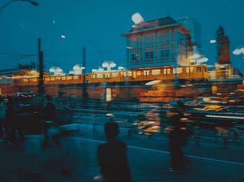 Blurred motion of city street and buildings at night