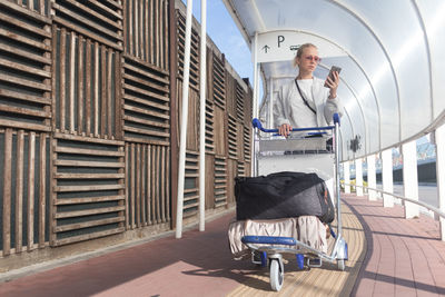 Man standing on seat in train