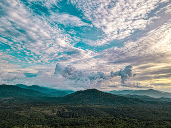 Scenic view of landscape against cloudy sky