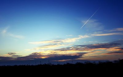 Low angle view of vapor trails in sky