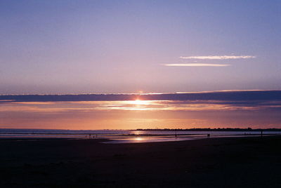 Scenic view of sea at sunset