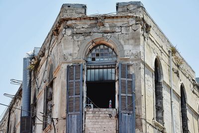 Low angle view of old building against clear sky