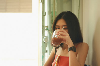 Young woman having drink