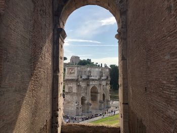 Buildings against cloudy sky