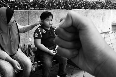 Baby boy sitting in park