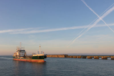 Entrance to the port of les sables d'olonne at dawn between the two piers