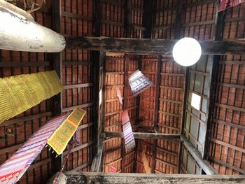 Low angle view of pendant lights hanging in building