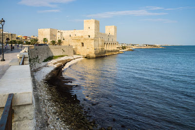 View of fort in sea against sky