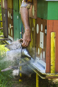 Man working by beehives