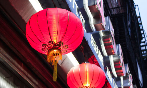 Low angle view of illuminated lanterns hanging in city