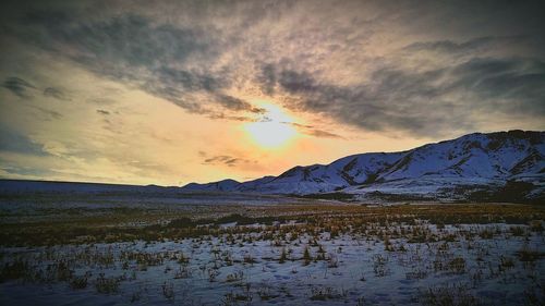 Scenic view of snow covered mountain against sky