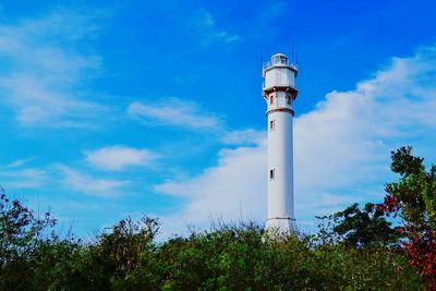 Low angle view of lighthouse against blue sky