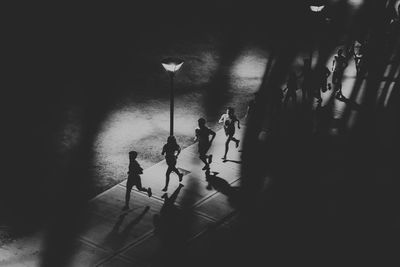 High angle view of people walking on footpath