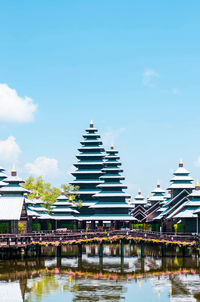 View of pagoda and buildings against sky
