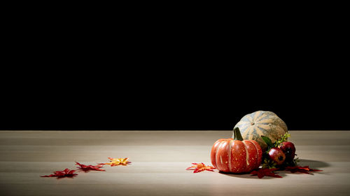 Close-up of pumpkins against black background