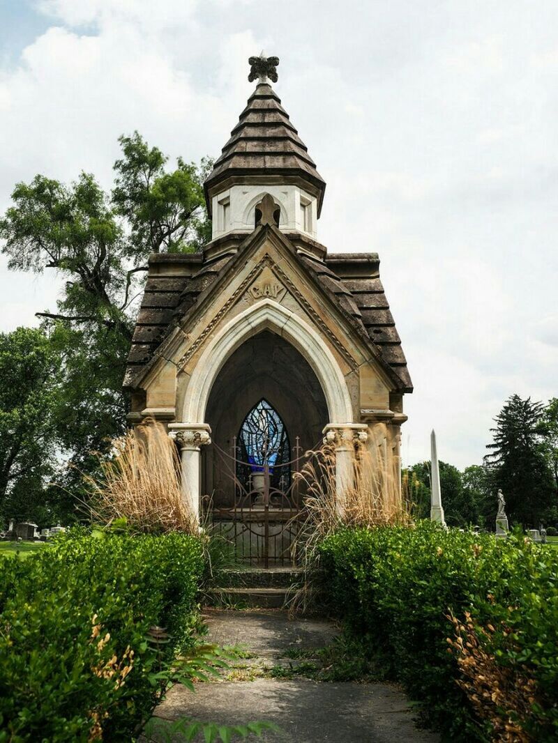 architecture, built structure, building exterior, sky, tree, arch, place of worship, religion, church, spirituality, cloud - sky, facade, low angle view, entrance, grass, plant, growth, day