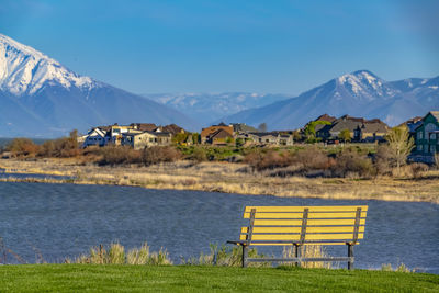 Scenic view of field and mountains against sky